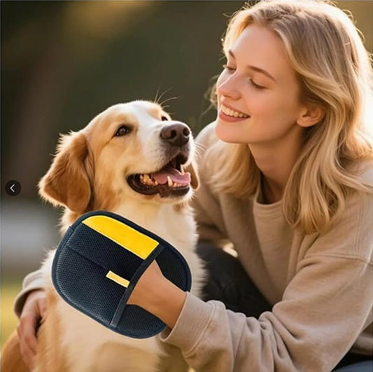 Woman holding a blue and yellow hair removal product while sitting with a dog outdoors.