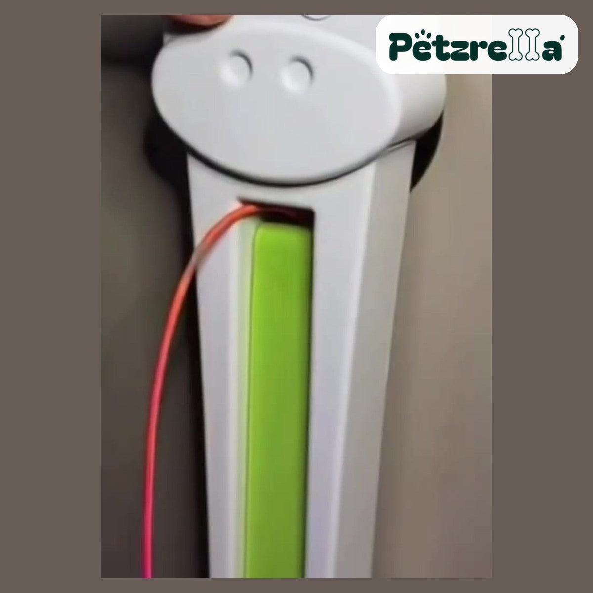 Close-up of the Petzrella Auto Cat Teaser cow-face housing and green channel