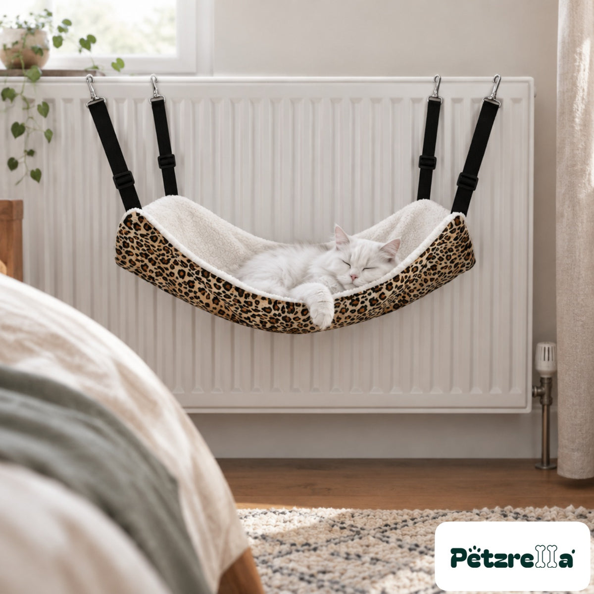 Petzrella Pet Cage Hammock on a bedroom radiator with a white cat asleep