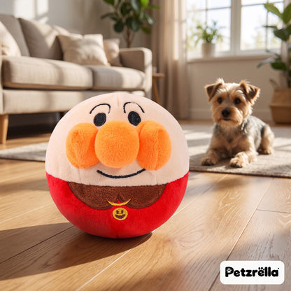 Petzrella bouncing plush ball dog toy on an oak floor with a Yorkshire terrier watching
