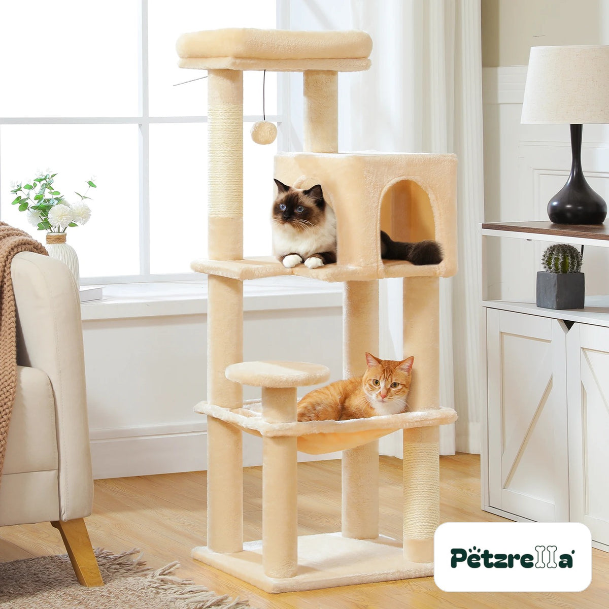 Petzrella cat tree 113 cm beige with condo, hammock and cats in a living room