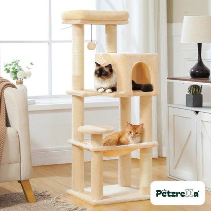 Petzrella cat tree 113 cm beige with condo, hammock and cats in a living room