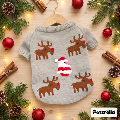 Petzrella knitted Christmas dog sweater with reindeer on a festive wooden table