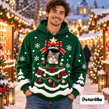 Petzrella Christmas pet pouch hoodie in Green Tree design with a tabby kitten in the pouch at a winter market