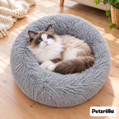 Petzrella Round Plush Donut Pet Bed in light grey with a ragdoll cat curled up inside
