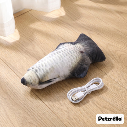 Petzrella silver carp flopping fish cat toy with USB charging cable on a wooden floor