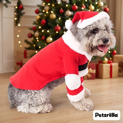 Petzrella Santa Claus pet costume, side view, dog in front of a Christmas tree