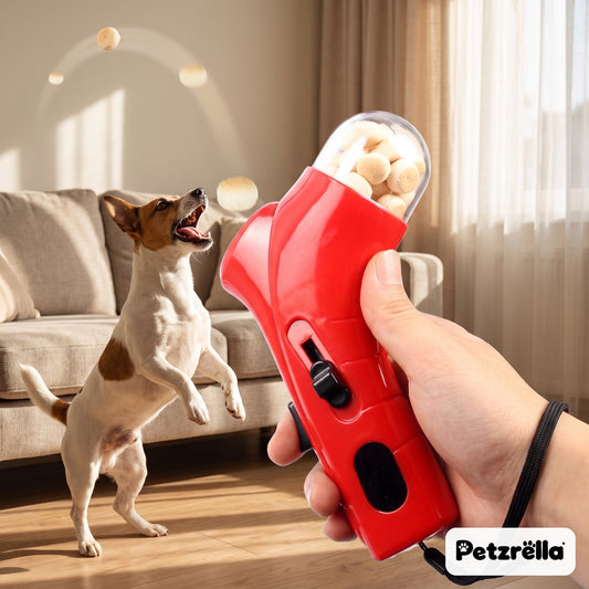 Petzrella red snack catapult launching biscuits to a jumping Jack Russell in the living room