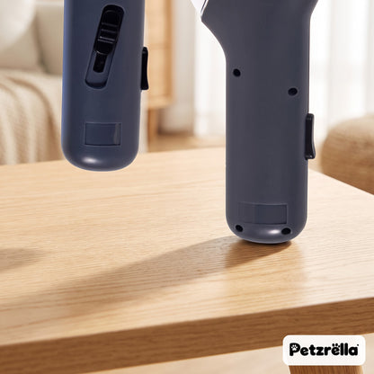 Petzrella interactive treat launcher close-up of the dark grey body and switch on a wooden table