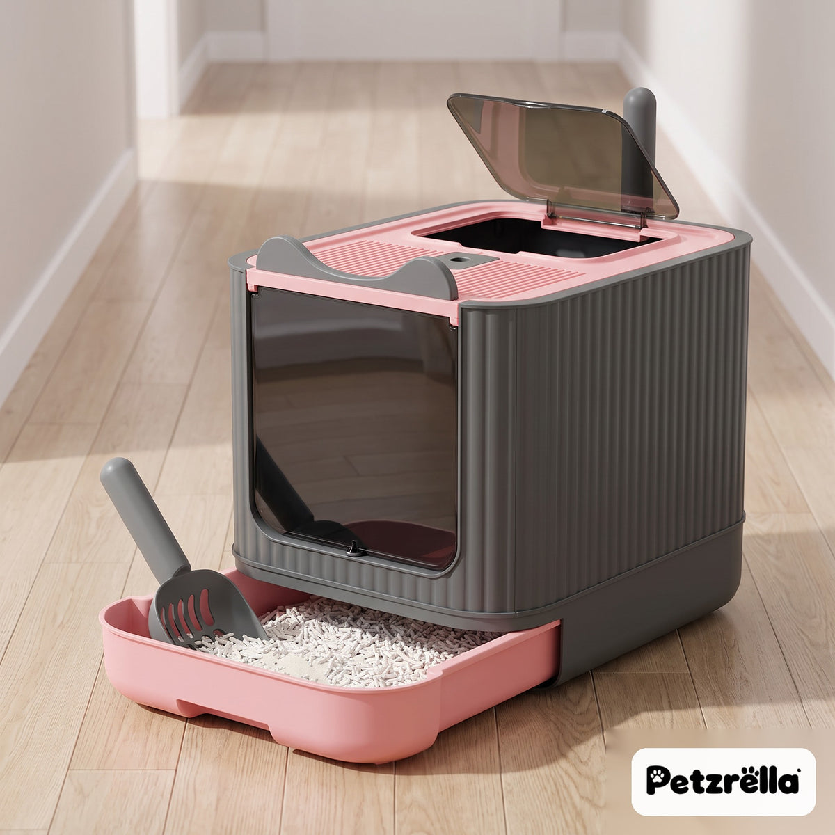 Petzrella XL enclosed cat litter box with pink pull-out drawer and scoop in a bright hallway